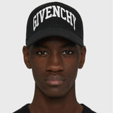 Man wearing black Givenchy designer baseball cap