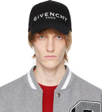 Man wearing black Givenchy Paris logo designer baseball cap